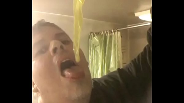 Faggot eats cum filled condom