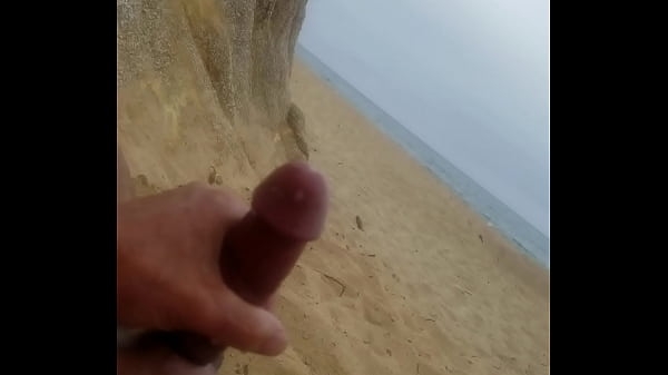 Beach masturbation with cumshot.