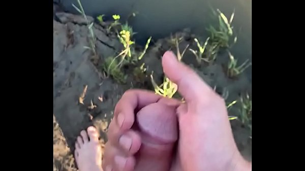 Hard cock on a public beach