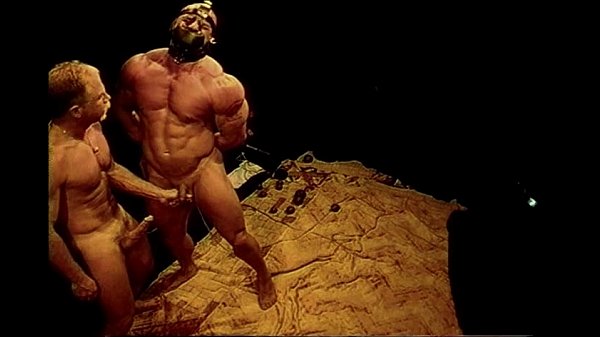 Squeezing huge bodybuilder’s balls.